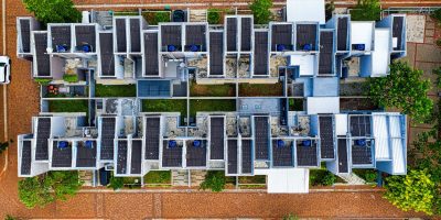 Drone shot of an organized residential area in Banten, Indonesia with solar panels.